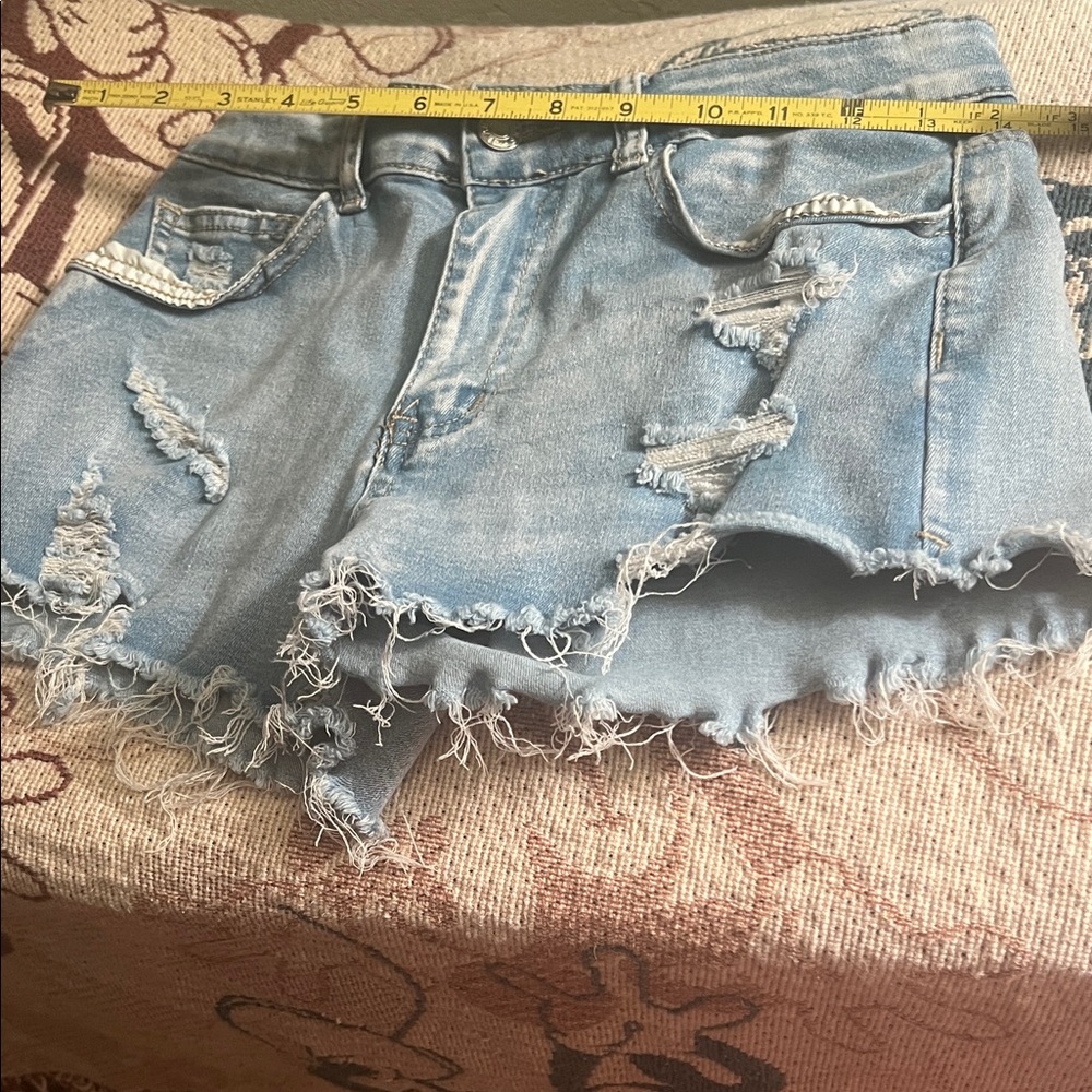 #1010+ Distressed Light Blue Denim Shorts - Picture 2 of 7